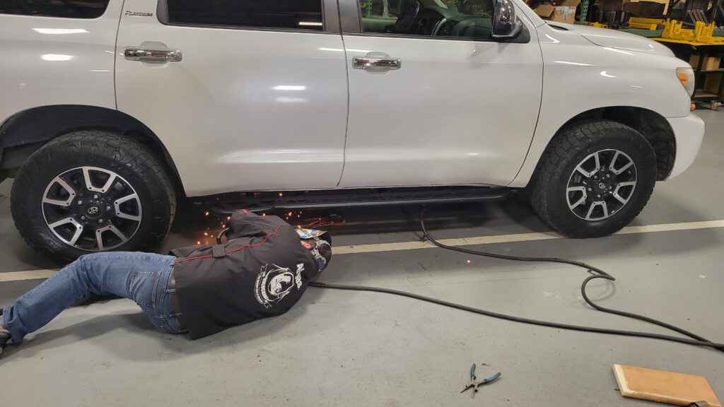 Land Rover Ron welding the Tandem Offroad Sliders to the 2008 Toyota Sequoia